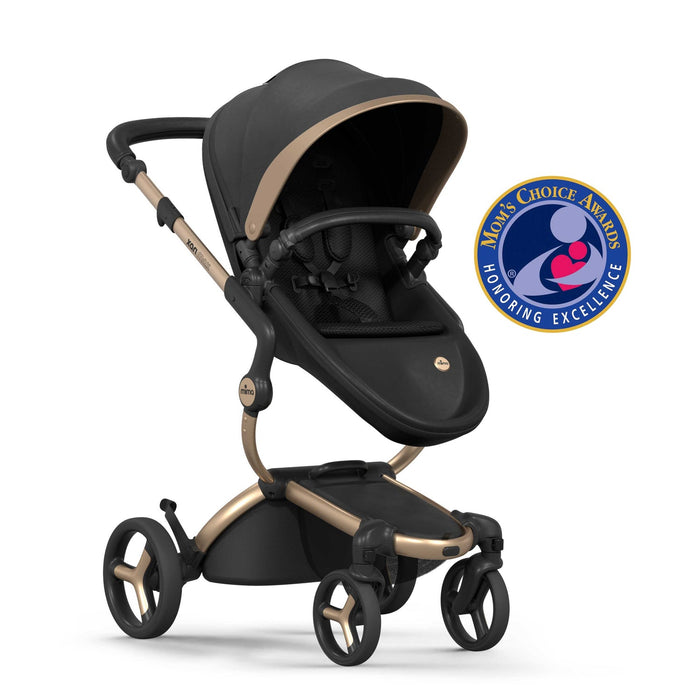 black and gold stroller and car seat MIMA