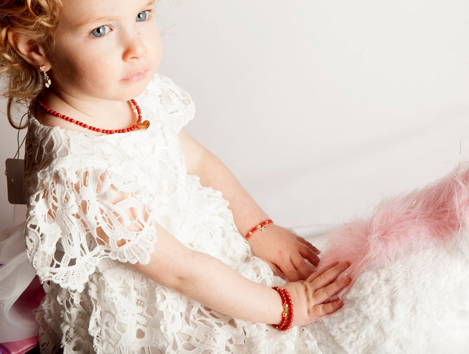 CRYSTAL DREAM RED PEARLS WITH GOLD BOW BRACELET